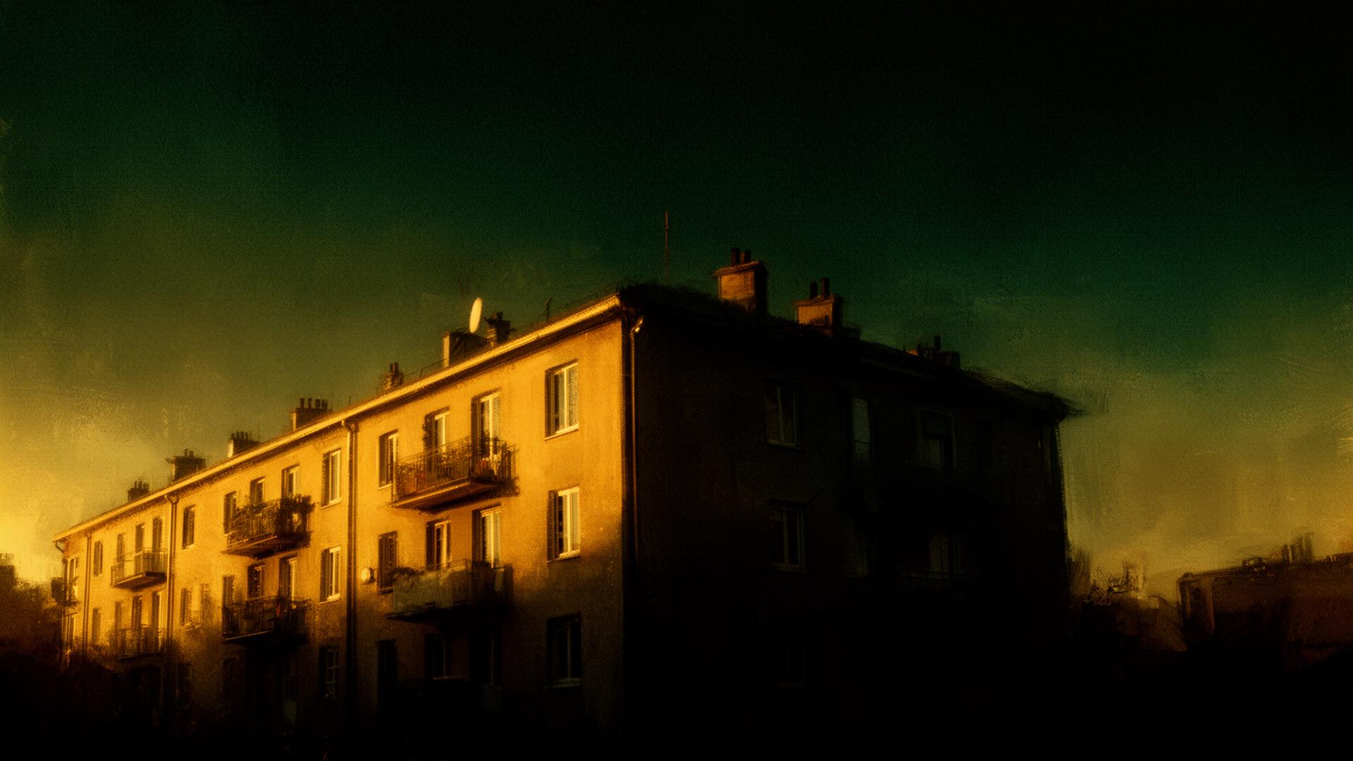 Apartment building under gold dawn